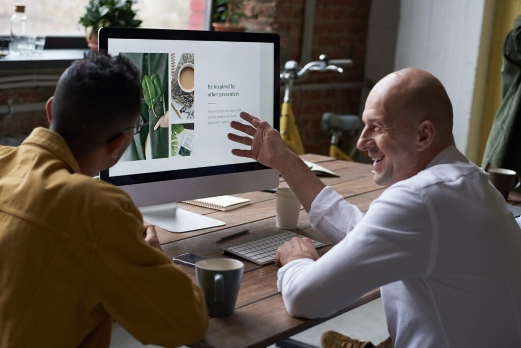 two people discussing on the computer